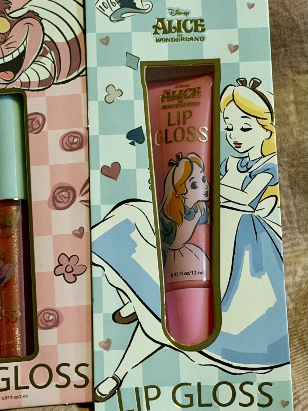 4 piece Alice in Wonderland Lip Gloss & Balm Set - Purple, Gold, Pink, Blue